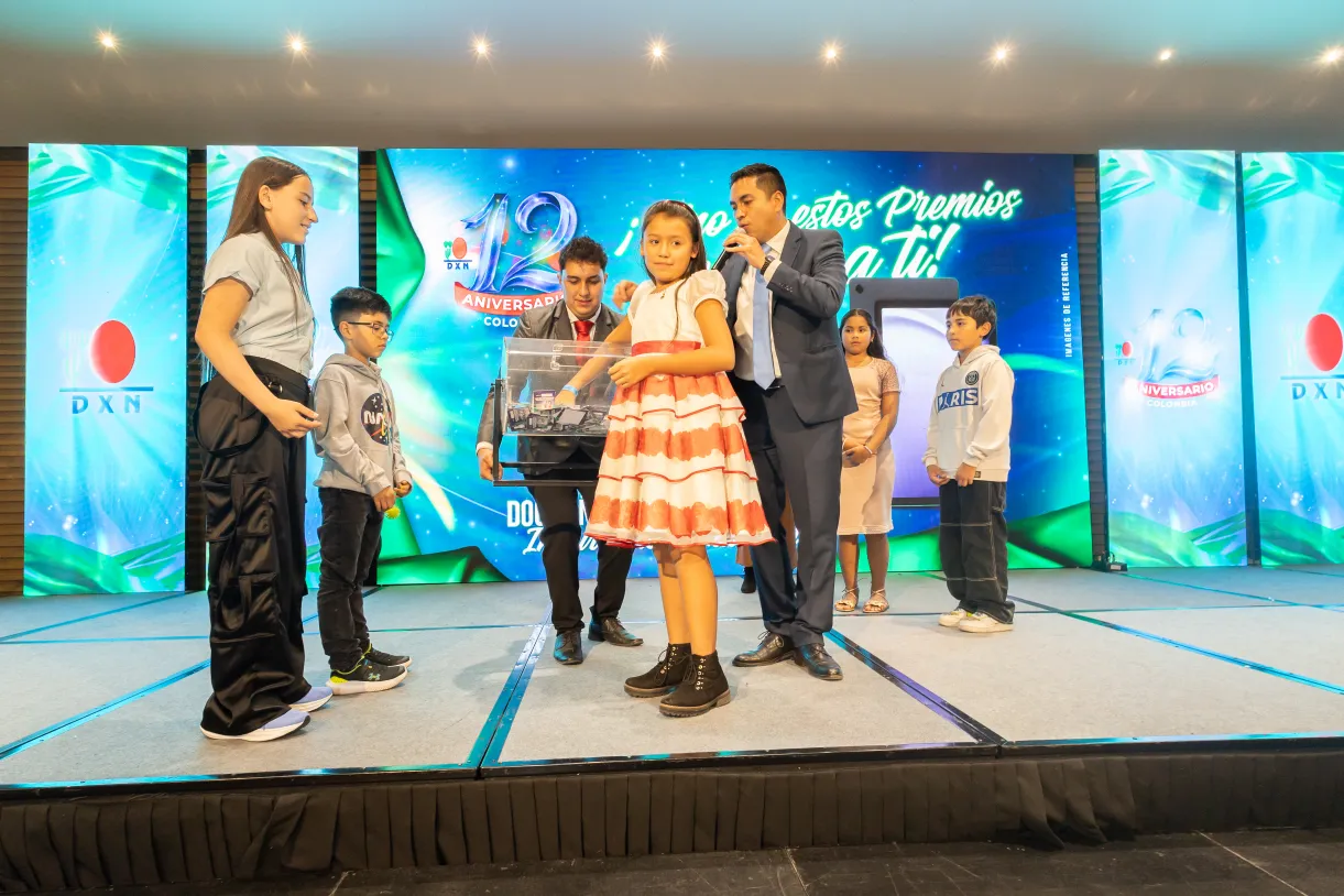 DXN – firma de acuerdo – fotografía corporativa en Bogotá